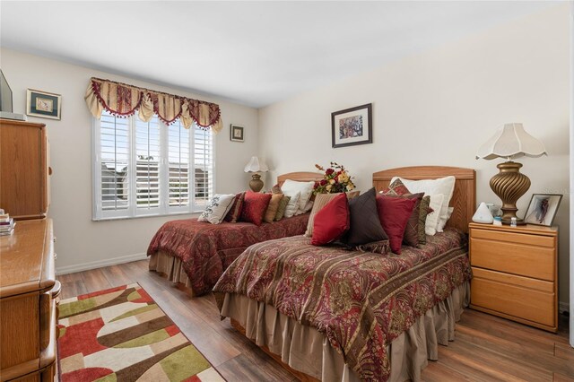 bedroom with wood-type flooring