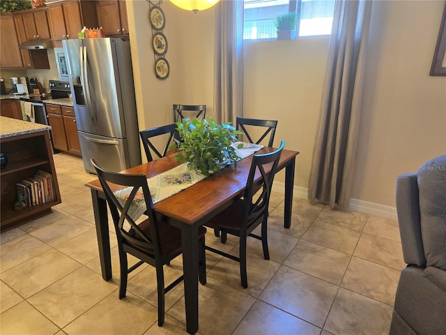 dining area with light tile floors