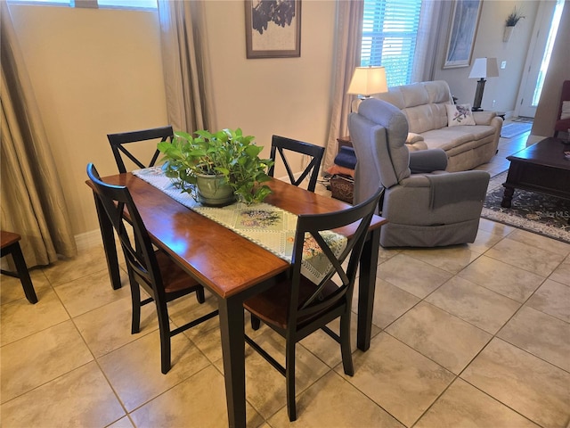 dining area with light tile floors