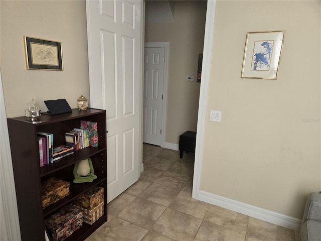 corridor featuring light tile flooring