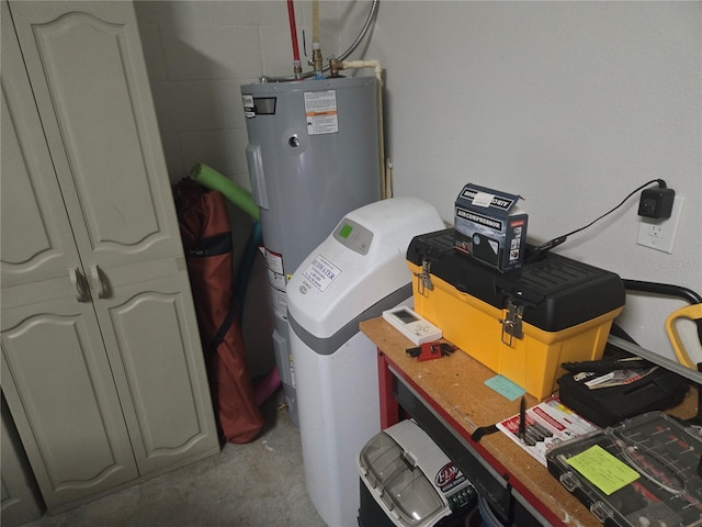 utility room featuring electric water heater