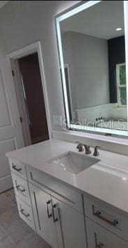 bathroom featuring tile patterned floors and vanity