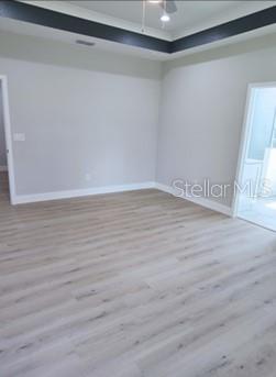 unfurnished room with hardwood / wood-style flooring