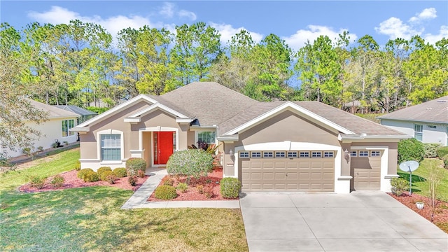 view of front of property featuring a front yard and a garage