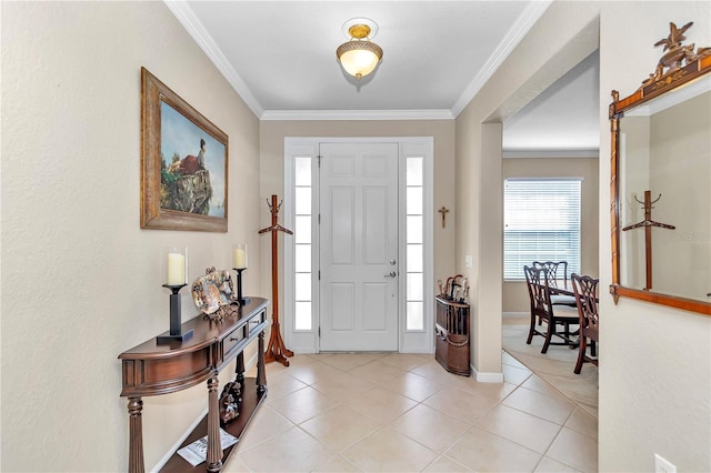 tiled entryway featuring ornamental molding