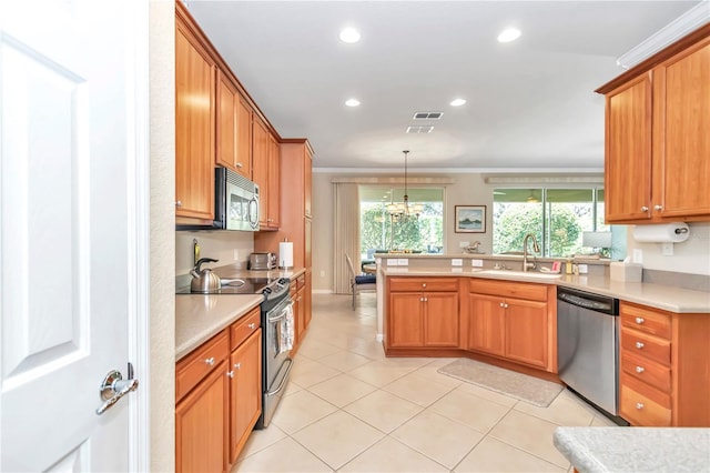 kitchen featuring sink, stainless steel appliances, light tile floors, a chandelier, and pendant lighting