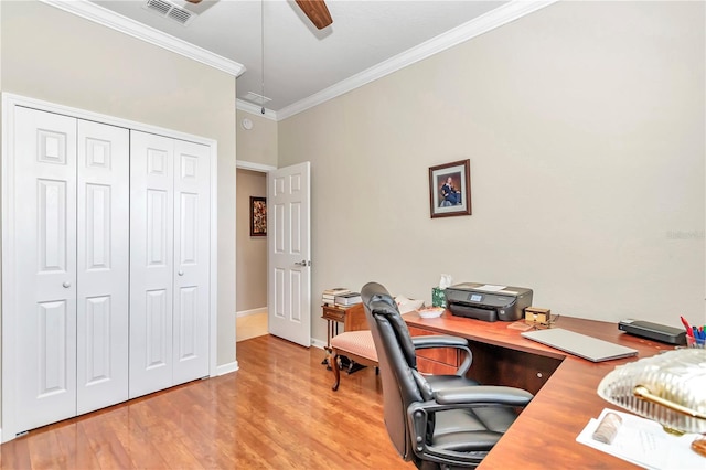 office area with ornamental molding, ceiling fan, and light wood-type flooring