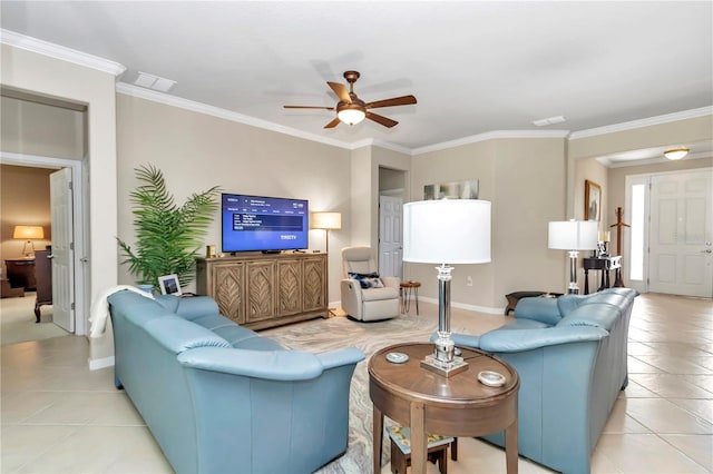 tiled living room with crown molding and ceiling fan