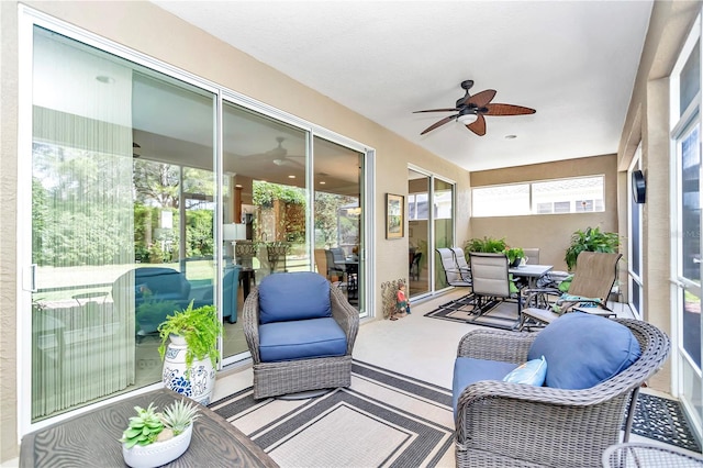 sunroom with ceiling fan