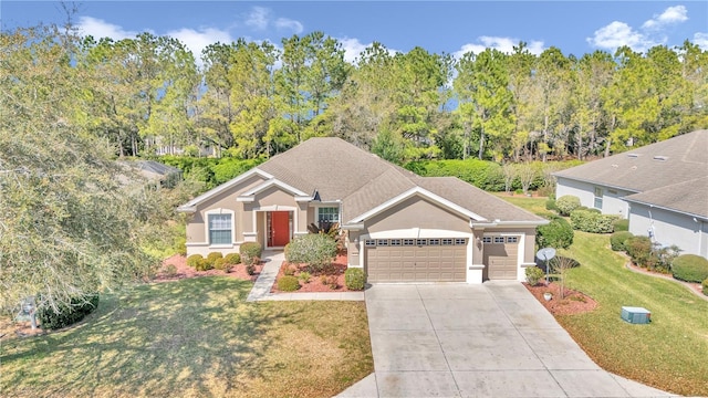 view of front of house featuring a front yard and a garage