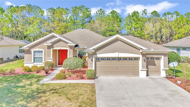 view of front of house with a front yard and a garage