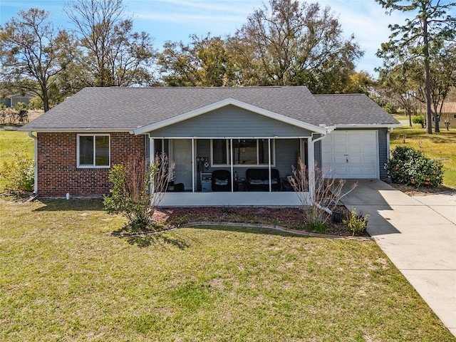 single story home with a front yard, a garage, and a sunroom