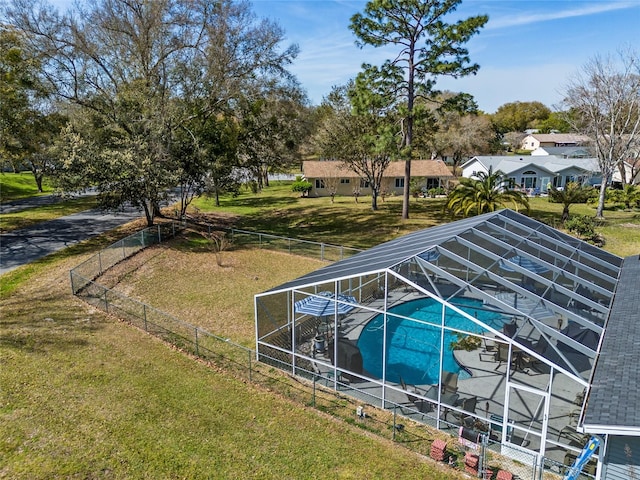 exterior space with a lawn and a lanai