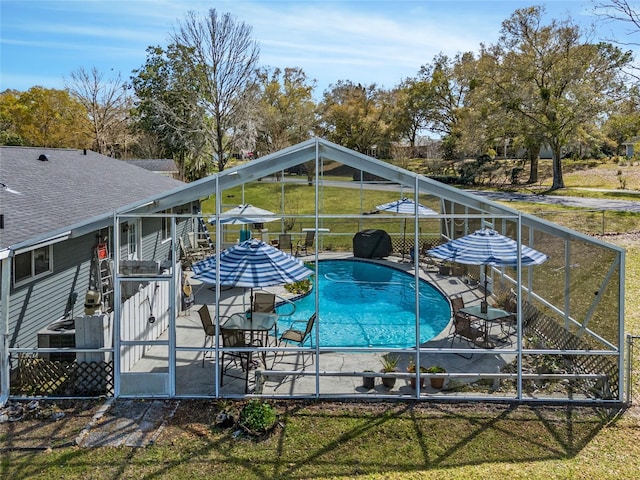 view of swimming pool with a yard and a patio area