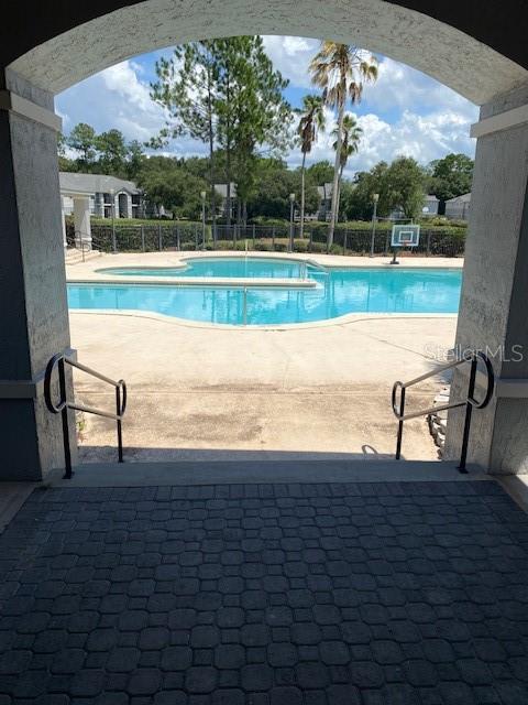 view of pool featuring a patio