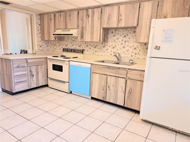 kitchen with sink, white appliances, light brown cabinetry, light tile patterned floors, and custom range hood