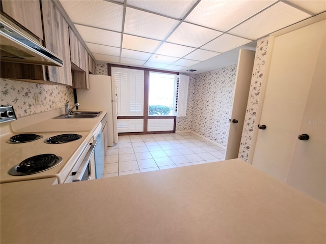 kitchen with light tile patterned floors, white appliances, sink, and exhaust hood