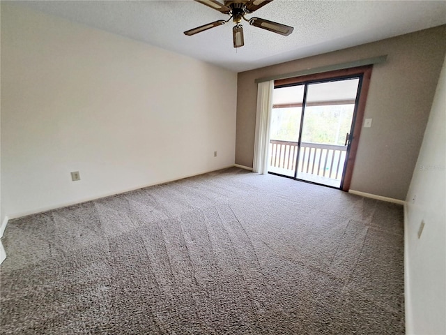 carpeted empty room with ceiling fan and a textured ceiling