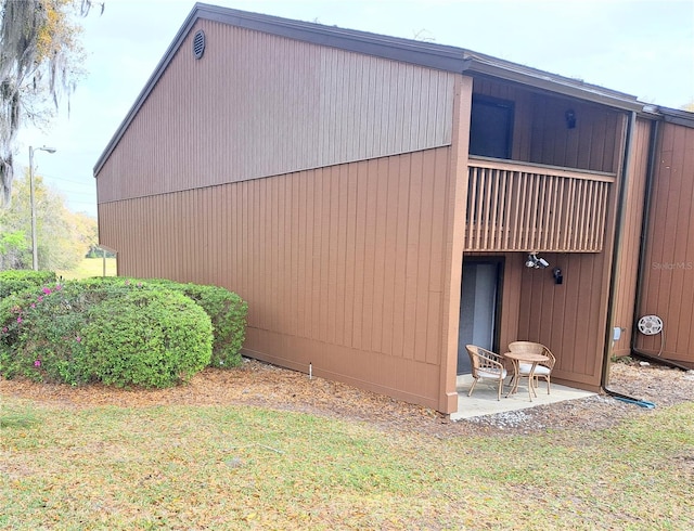 view of side of home with a patio area