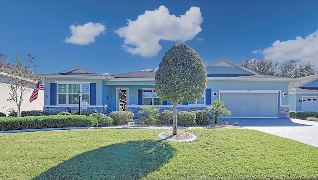 view of front of property featuring a front lawn and a garage