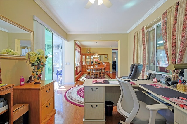 office area with ornamental molding, light wood-type flooring, and a ceiling fan