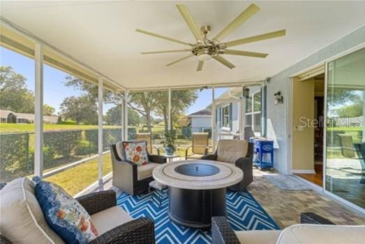 sunroom / solarium with ceiling fan