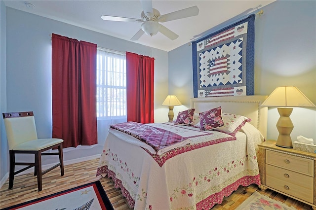 bedroom with a ceiling fan and wood finished floors