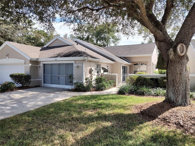 single story home with a front lawn and a garage