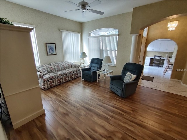 living room featuring ceiling fan and light tile floors