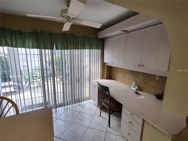 tiled office space with ceiling fan