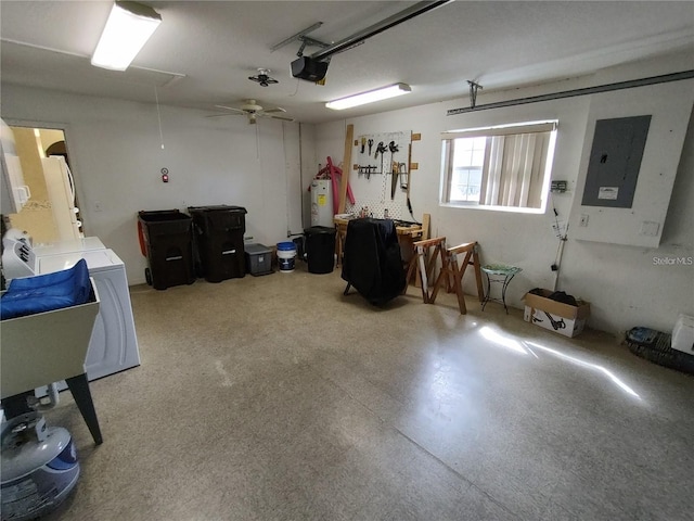 garage featuring water heater, ceiling fan, and washer / clothes dryer