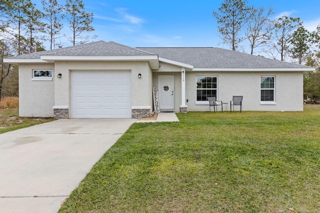 single story home with a front lawn and a garage