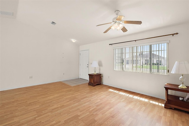 living room featuring light wood-type flooring and ceiling fan