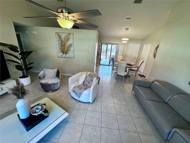 tiled living room featuring ceiling fan