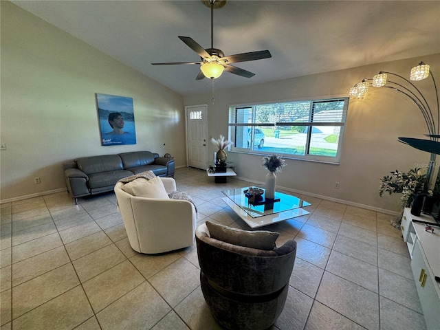 living room with lofted ceiling, light tile patterned flooring, and ceiling fan