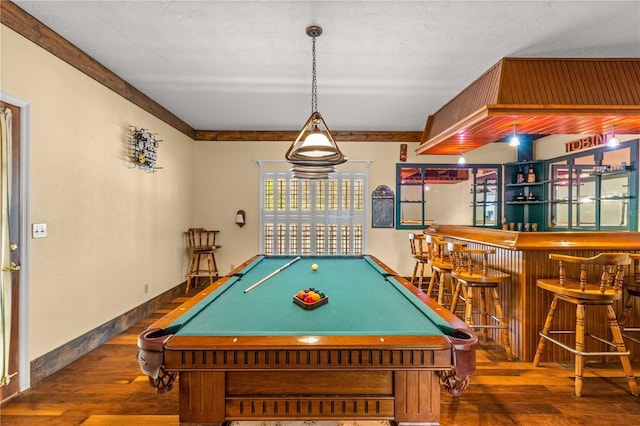 recreation room featuring dark hardwood / wood-style floors, bar, and billiards