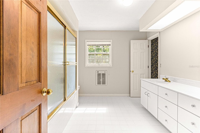 bathroom featuring shower / bath combination with glass door, vanity, and heating unit