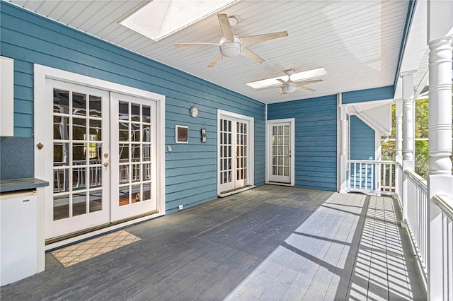 exterior space with ceiling fan, french doors, and a skylight