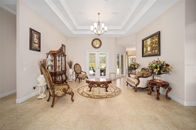 sitting room with light tile floors, french doors, an inviting chandelier, and a tray ceiling