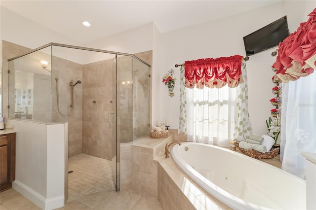 bathroom with separate shower and tub, vanity, and tile flooring