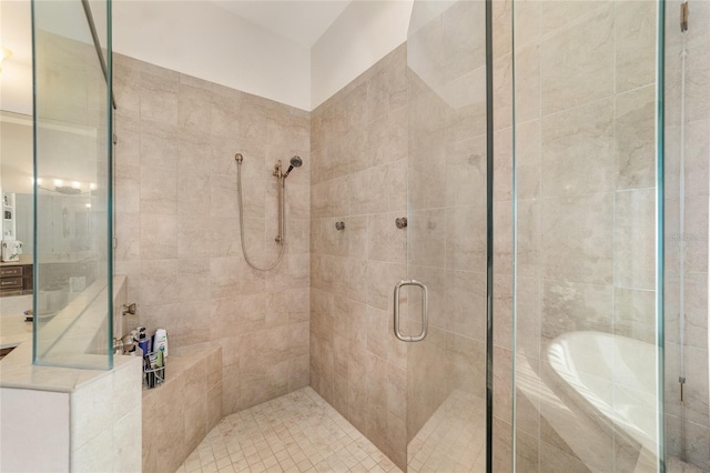 bathroom featuring shower with separate bathtub