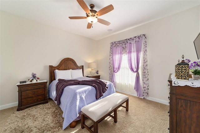 bedroom with light colored carpet and ceiling fan