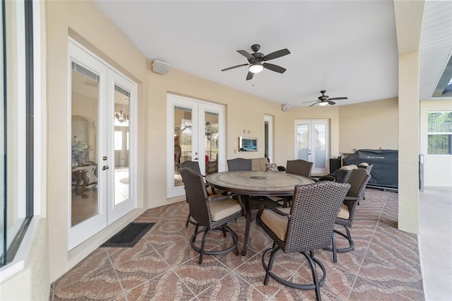 view of terrace featuring ceiling fan and french doors