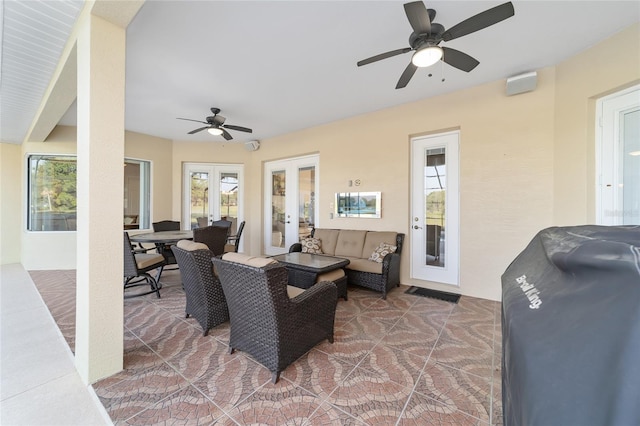 view of terrace featuring outdoor lounge area and ceiling fan