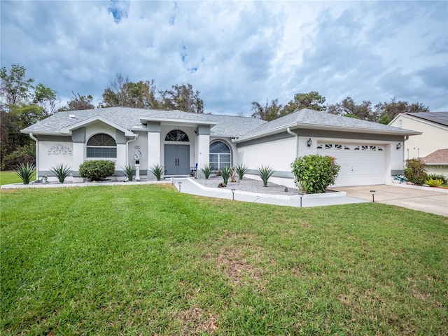 ranch-style home with a front yard and a garage