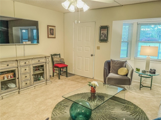 carpeted living room featuring ceiling fan