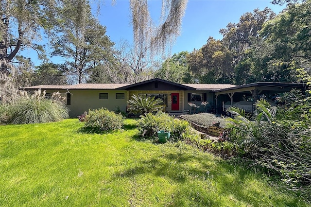 back of house featuring a yard