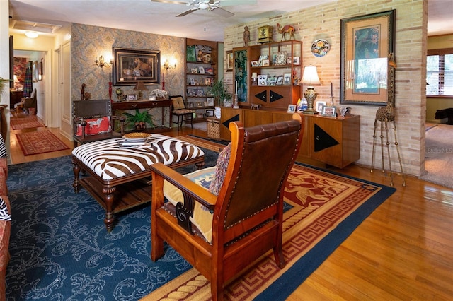 living room with ceiling fan and dark hardwood / wood-style flooring