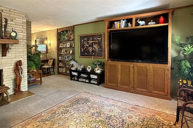 living room with a textured ceiling, brick wall, and light colored carpet