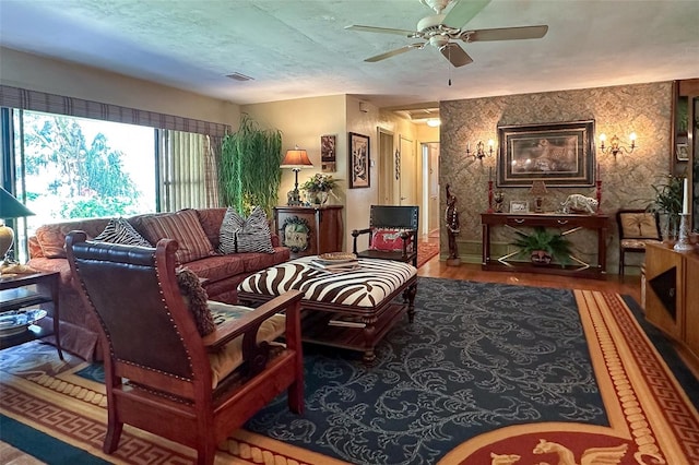 living room featuring dark hardwood / wood-style floors and ceiling fan